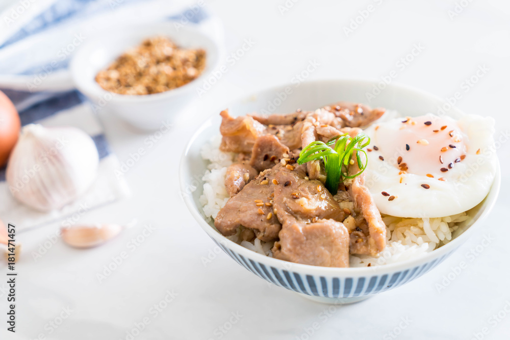 stir-fried pork with garlic on topped rice with egg stir-fried pork with garlic on topped rice with egg