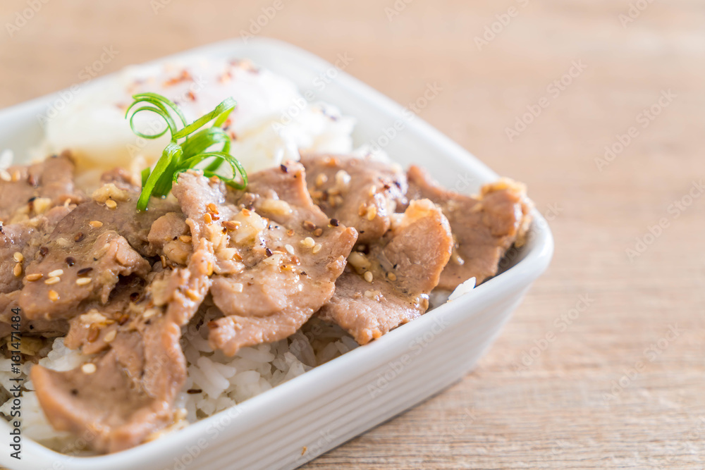 stir-fried pork with garlic on topped rice with egg stir-fried pork with garlic on topped rice with egg