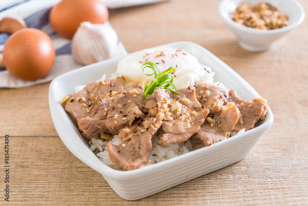 stir-fried pork with garlic on topped rice with egg stir-fried pork with garlic on topped rice with egg