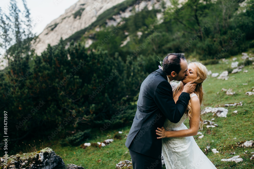 Beautiful bride and groom in the forest at summer Beautiful bride and groom in the forest at summer