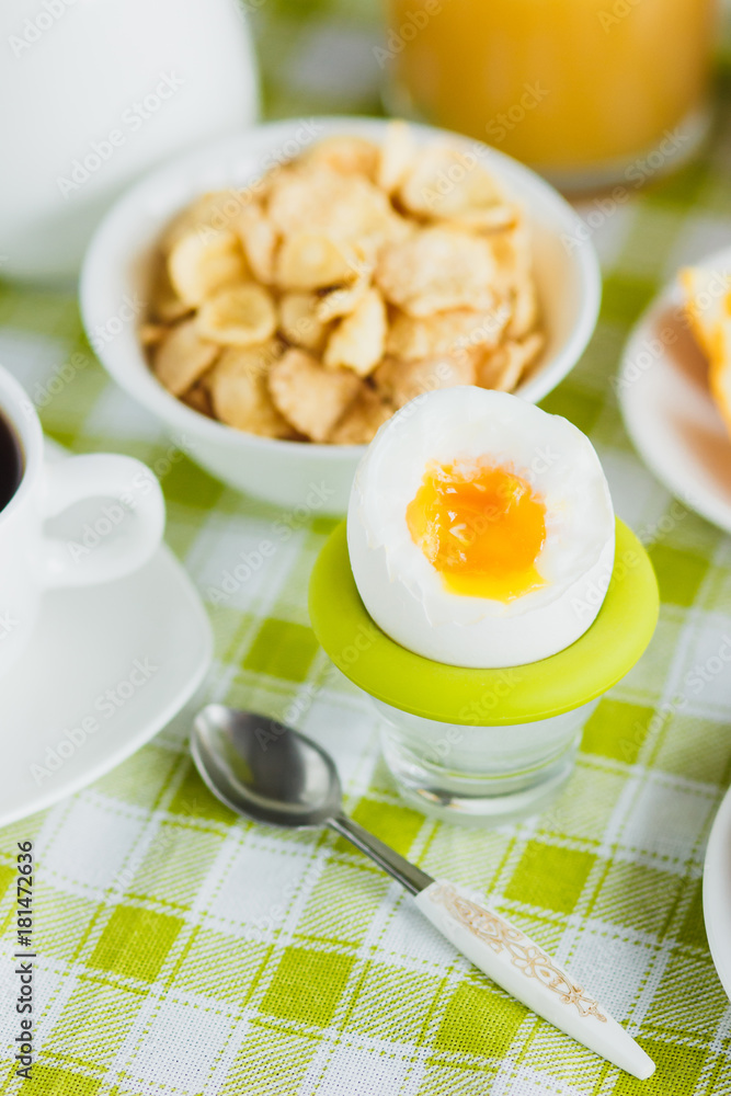 Soft boiled chicken egg, coffee, muesli and orange juice Soft boiled chicken egg, coffee, muesli and orange juice