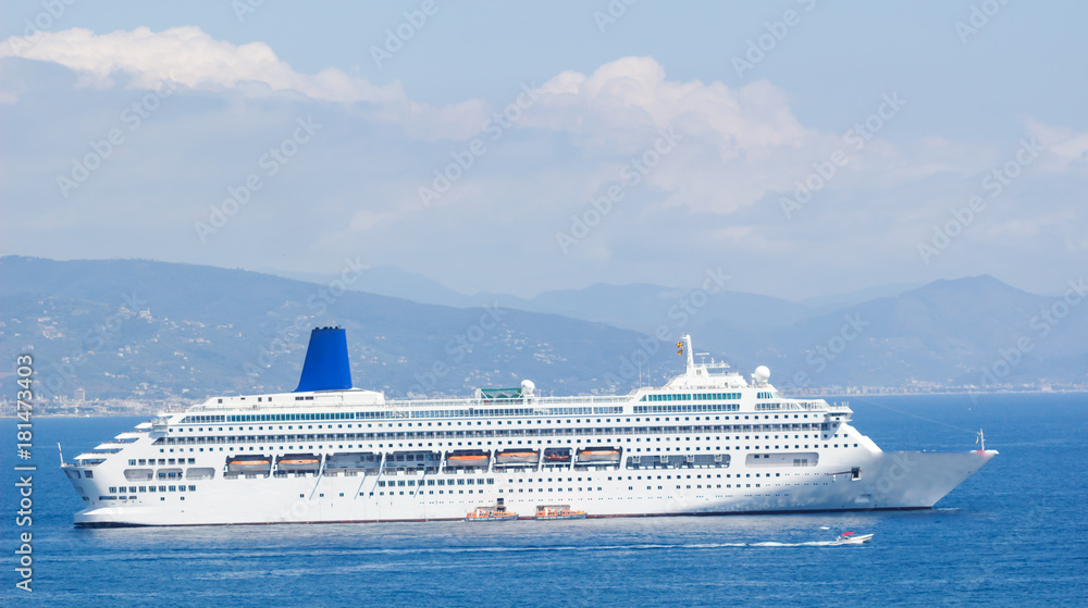 Cruise Ship Sailing from Port. , A large yacht underway sailing out on tropical sea.