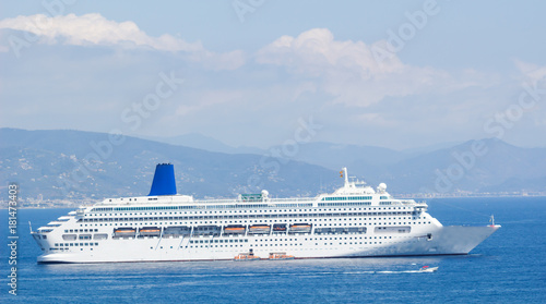 Cruise Ship Sailing from Port. , A large yacht underway sailing out on tropical sea. © parntawan1987
