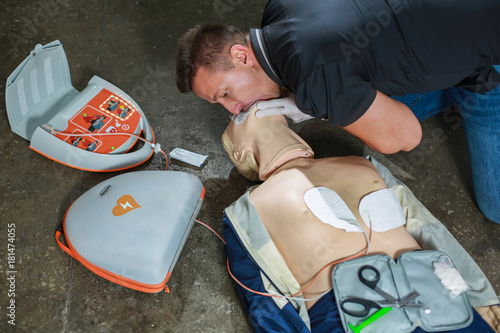 The use of an automatic external defibrillator in conducting a basic cardiopulmonary resuscitation to the victim on the street photo