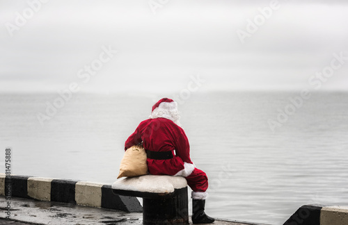 Santa claus looking look into the distance. Loneliness concept.
