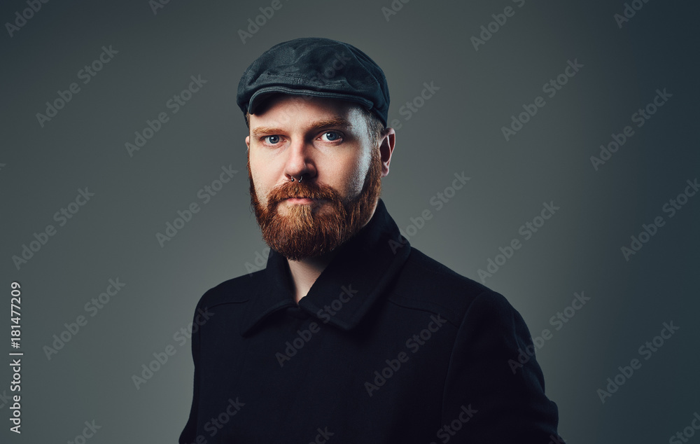 Obraz premium A man with redbeard over grey background.