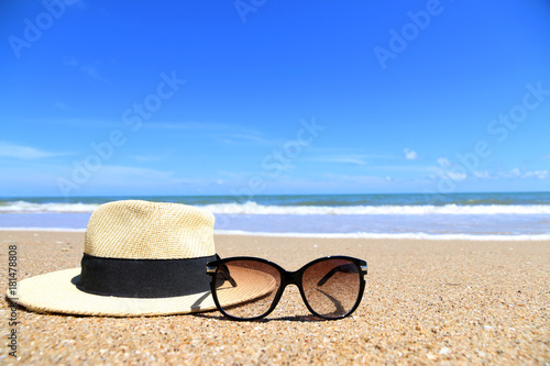 mock up Glasses and hats on the beach Asia space for your text.
