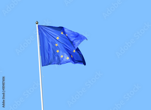 European Union EU flag flies over clear blue sky