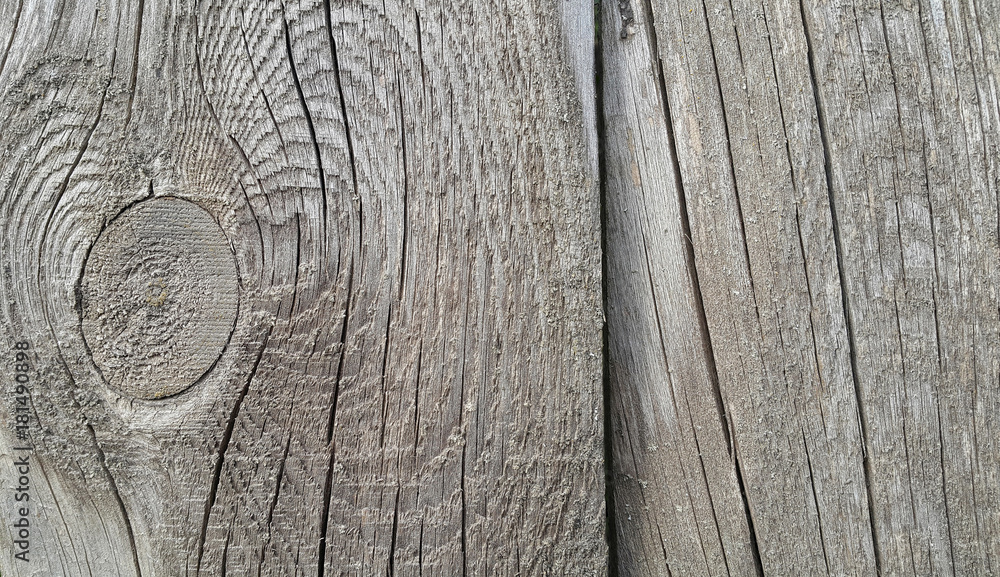 Old weathered wooden texture with rings and cracks Old weathered wooden texture with rings and cracks