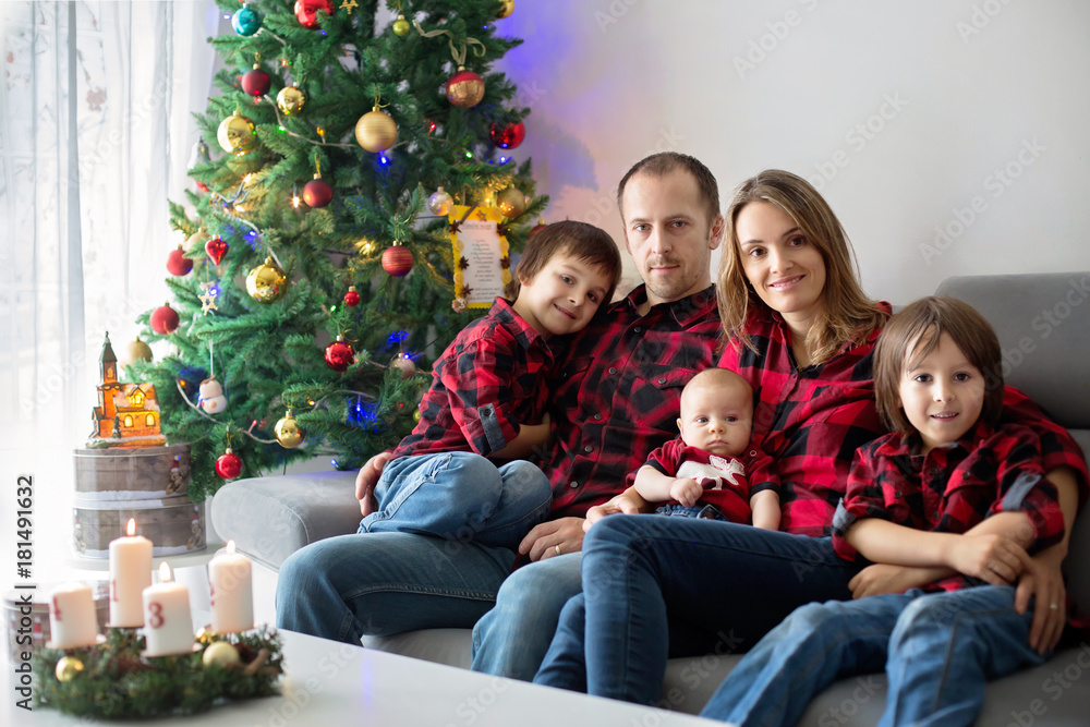 Happy family portrait on Christmas, mother, father and three children
