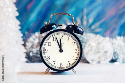 New Year alarm clock on a silver and blue background
