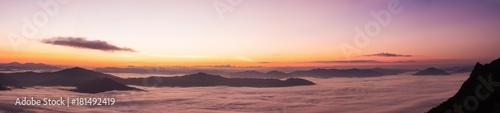 Panorama shot, Beautiful landscape, mist over the mountain at sunrise. View from high mountain at Doi Pha Tung, Chiangrai, Thailand, Lao.