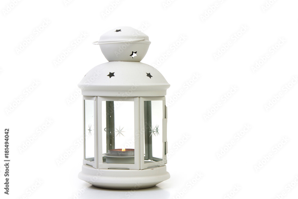 white lighthouse with a burning candle inside on a white background