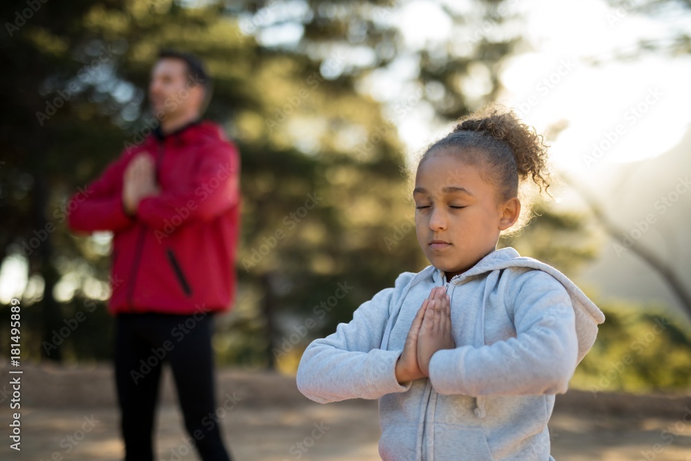 Close-up of girl meditating in park Close-up of girl meditating in park