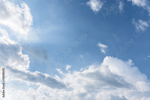 A blue sky with white clouds and sunlight in a nice weather day