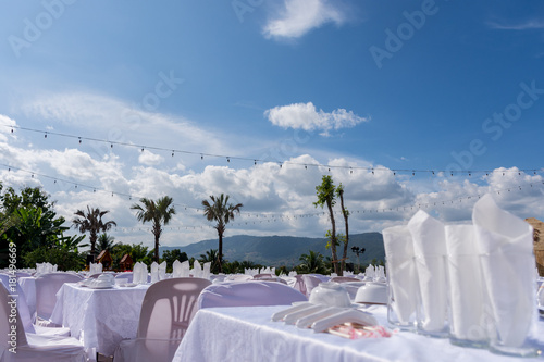Outdoor catering event for lunch with nice scenic of mountain and coconut trees