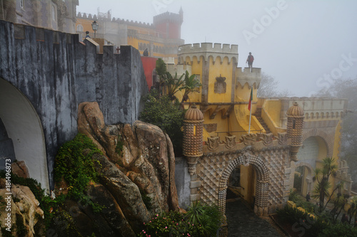 Fotografie Pena Palace , romanticist castle in a foggy autumn day at Sintra , Portugal