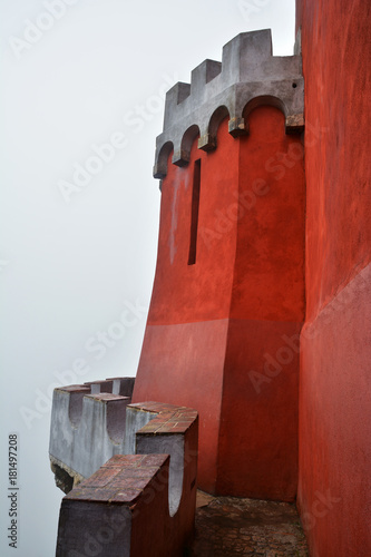 Фотография Pena Palace , romanticist castle in a foggy autumn day at Sintra , Portugal