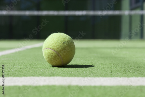 Tennis court with a close up ftom a tennisball