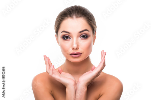 Beautiful Young Woman with Clean Fresh Skin on white background. Facial treatment . Cosmetology , beauty and spa .