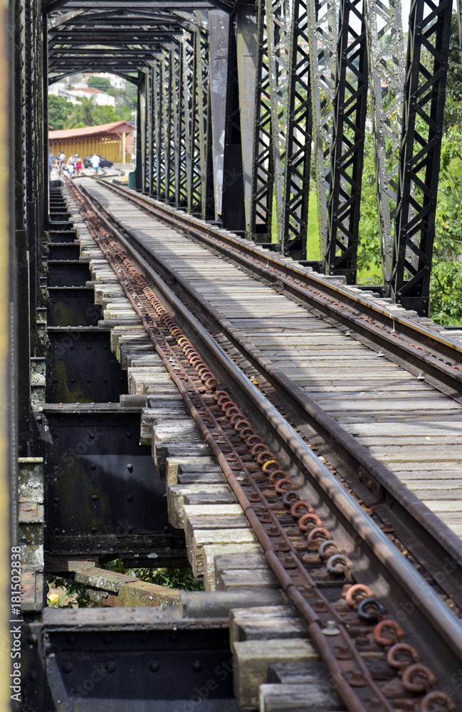 Old railway bridge, with iron trellis, in perspective Old railway bridge, with iron trellis, in perspective