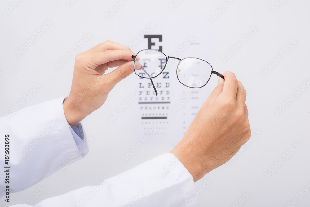 New glasses. Optometrist giving eyeglasses to try New glasses. Optometrist giving eyeglasses to try