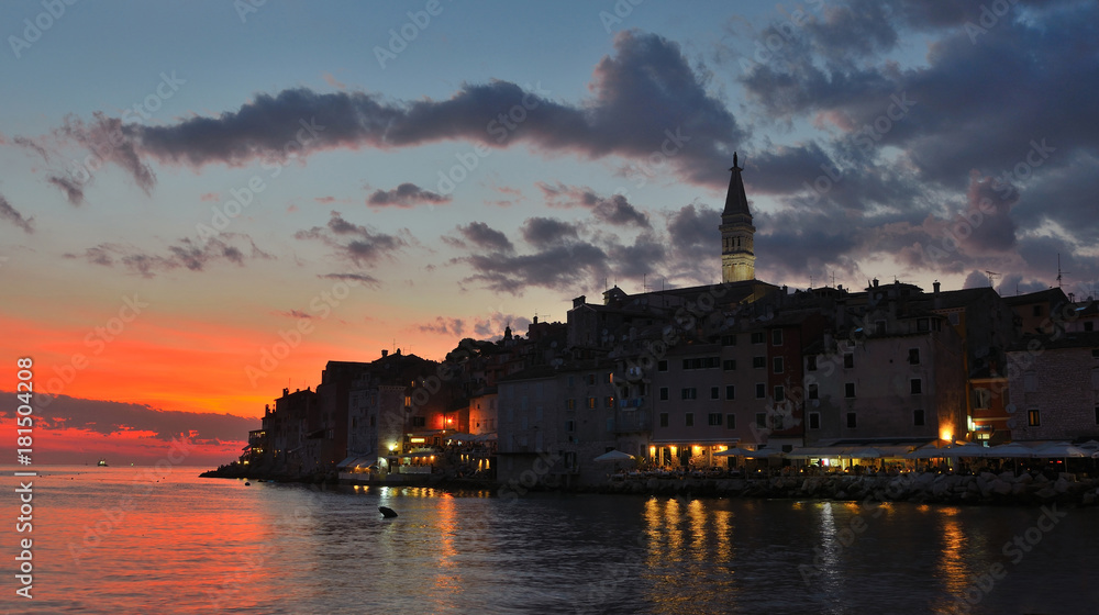 Old town of Rovinj shortly after sunset with lights and reflections