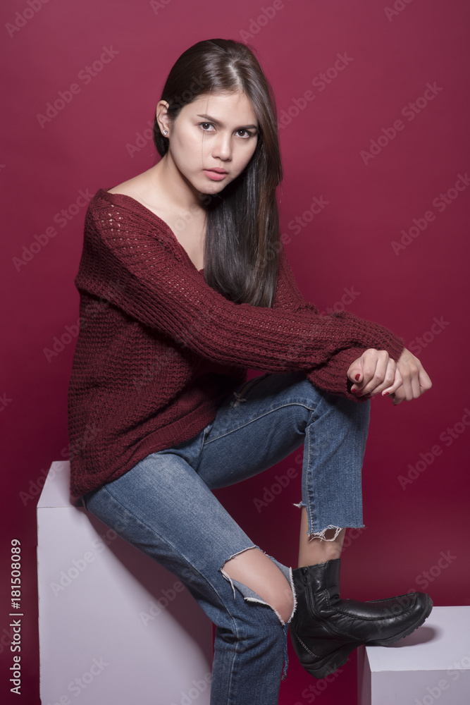 Beautiful woman portrait in studio on red background Beautiful woman portrait in studio on red background