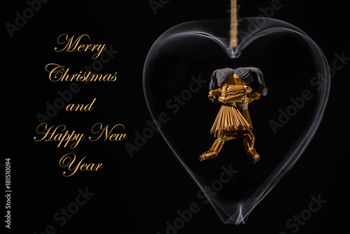 Christmas greeting with dancing straw dolls in a heart