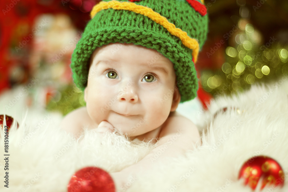 Newborn Baby Portrait, Happy New born Kid Boy in Christmas Green Hat Newborn Baby Portrait, Happy New born Kid Boy in Christmas Green Hat