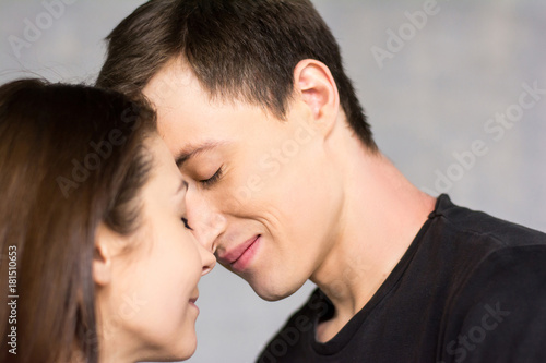 Portrait of young beautiful lovers. Studio shot of young couple of loving people with warm feeling of real love.