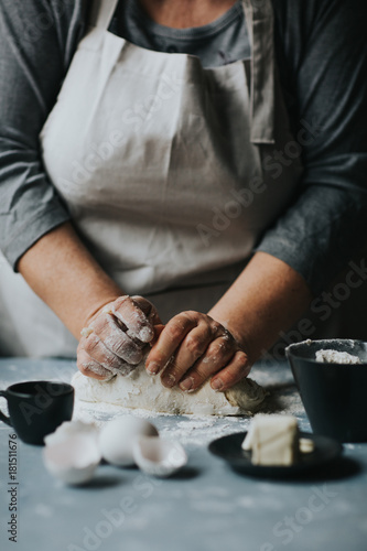 Woman working with dough 