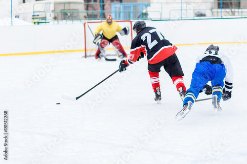 Young skater man in attack. Ice hockey game image with copy space