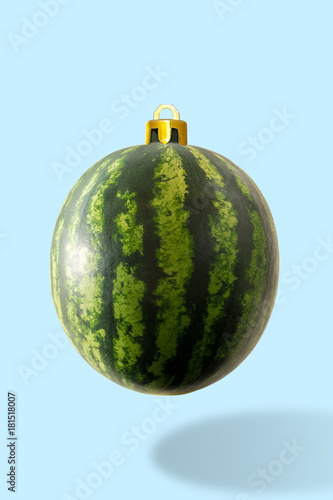 Christmas bauble decoration made of watermelon. Minimal New year concept.