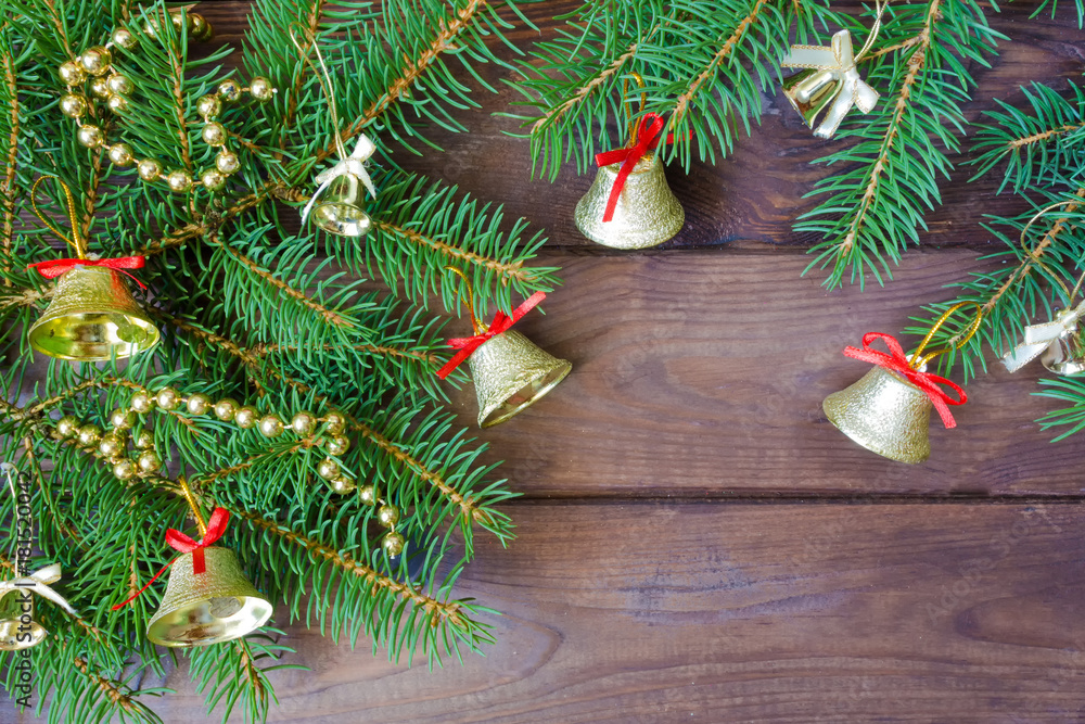 Christmas decorations frame background of fir branches, sosonic cones and cranberries on a black background with copy space forks from above Christmas decorations frame background of fir branches, sosonic cones and cranberries on a black background with copy space forks from above