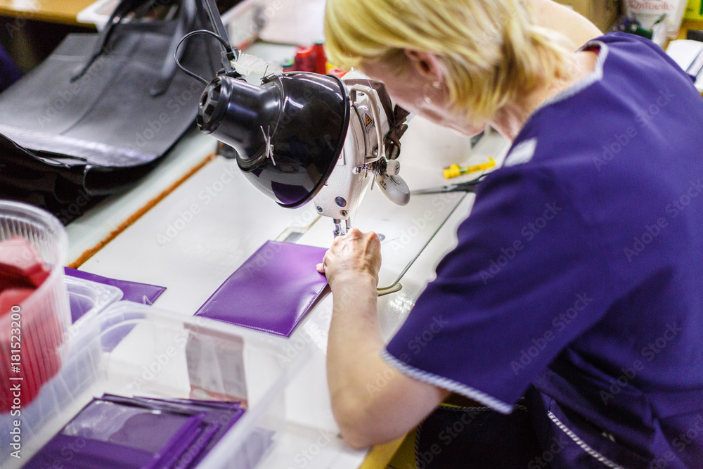 Fototapeta premium woman stitching a purse