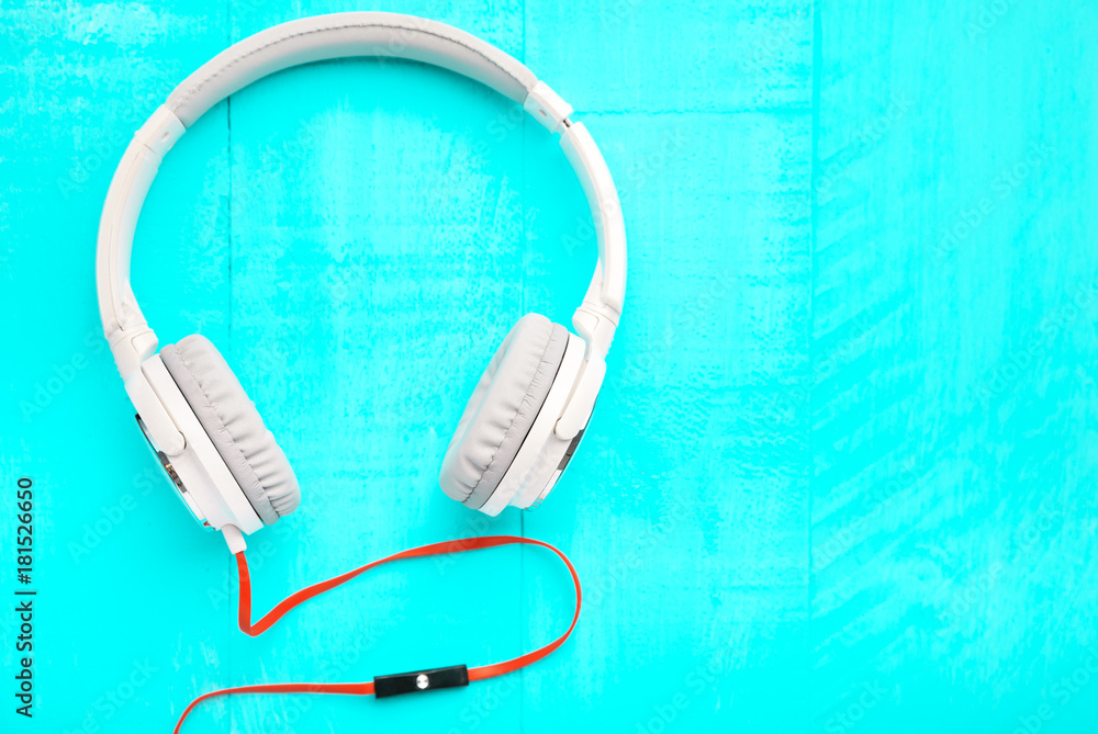 Headphones on wooden desk table - Music concept - Top view with copy space Headphones on wooden desk table - Music concept - Top view with copy space