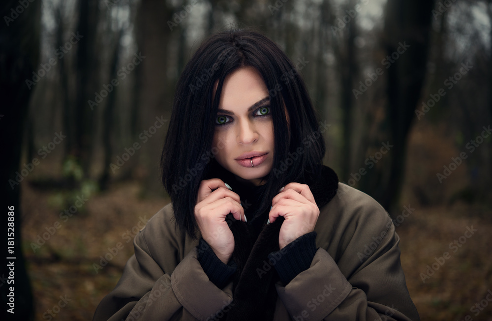 Portrait of a girl in the forest. Green eyes. Autumn forest. Portrait of a girl in the forest. Green eyes. Autumn forest.