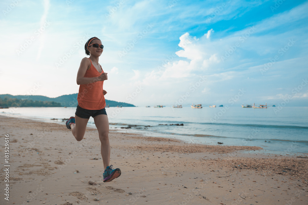 young fitness woman runner running on sandy beach young fitness woman runner running on sandy beach