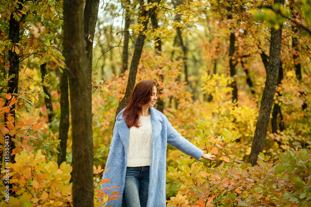 Girl walking in autumn park Girl walking in autumn park