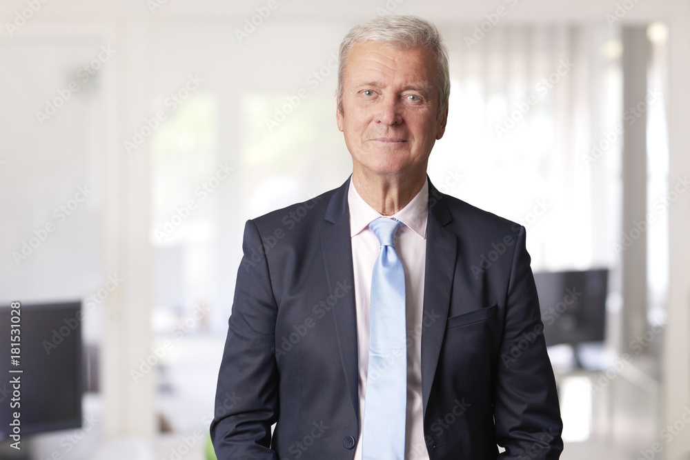 Senior executive manager standing at office. Senior executive manager standing at office.