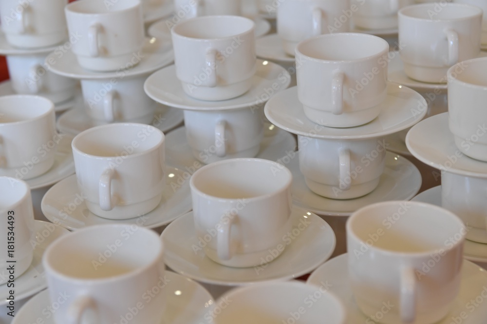 Empty white cups with plates
Empty white cups with plates