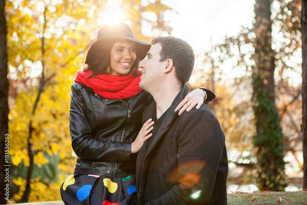 Fototapeta premium Beautiful happy couple in autumn park relaxing