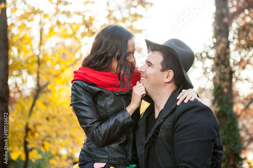 Beautiful in love happy couple in autumn park having fun