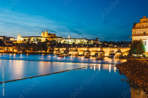 View of Charles Bridge and Vltava river at night in Prague, Czech Republic