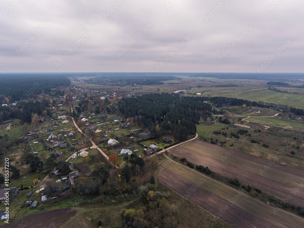 Aerial view over rural village near border in Lithuania.