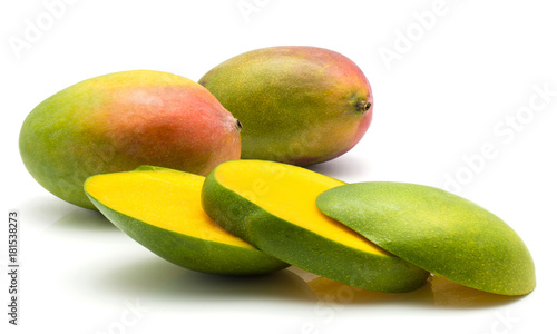 Sliced mango isolated on white background two whole and three slices.