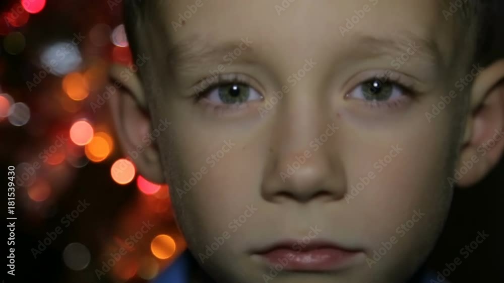Portrait of a child in the background of Christmas lights Portrait of a child in the background of Christmas lights