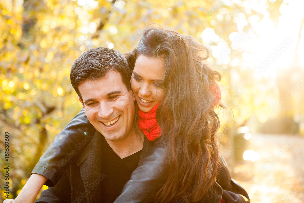 Beautiful romantic couple in autumn park having fun Beautiful romantic couple in autumn park having fun