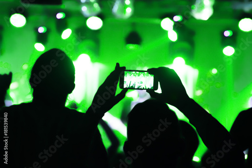 Video recording of the concert on the smartphone phone of the Beach or club party. Ð¡onceptual background of the youth party. blurred.